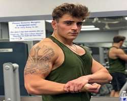 He has a huge tattoo on his arm.